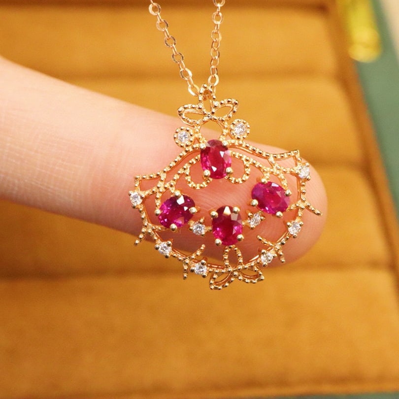 14k Gold 0.97 Ctw Natural Ruby & Diamond Pendant( Without Chain ): Ref:230996246 // gold content:14k gold // main gemstone:ruby // shape:oval // carat weight:0. 87ct // color:red // treatment:natural // // adjacent gemstone 2 : diamond // number of stones:10 //