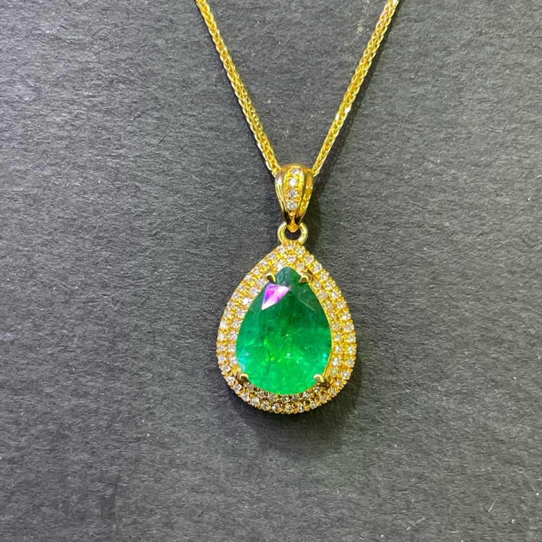 14k Gold 1.8 Ct Natural Emerald & Diamond Pendant( Without Chain ): Ref:230996314 // gold content:14k gold // main gemstone:emerald // shape:pear // carat weight:1. 8ct // color:green // treatment:natural // // adjacent gemstone 2 : diamond // number of stones:72 // s