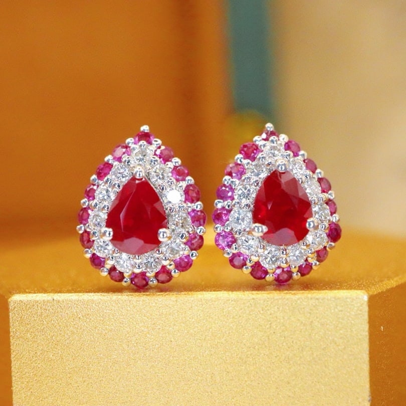 14k Gold 0.93 Ctw Natural Ruby & Ruby Earrings: Ref:230996317 // gold content:14k gold // main gemstone:ruby // shape:pear // carat weight:0. 65ct // color:pigeonblood red // treatment:natural // // adjacent gemstone 2 : ruby // shape:round //