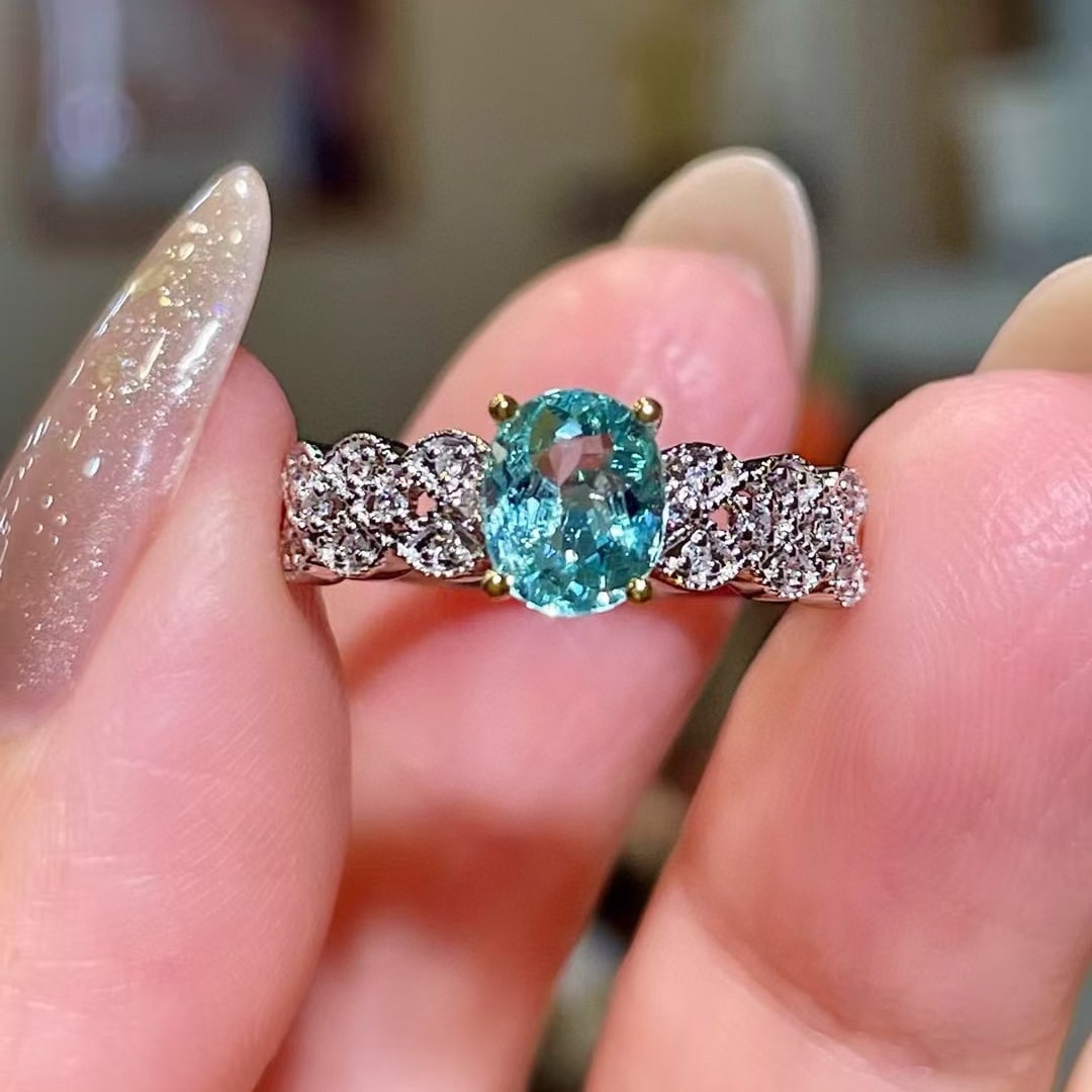 14k Gold 0.89 Ctw Natural Paraiba Tourmaline & Diamond Ring: Ref:230996373 // gold content:14k gold // ring size:7. 25us // // main gemstone:paraiba tourmaline // shape:oval // carat weight:0. 80ct // color:blue // treatment:natural // // adjacent gemstone 2 :