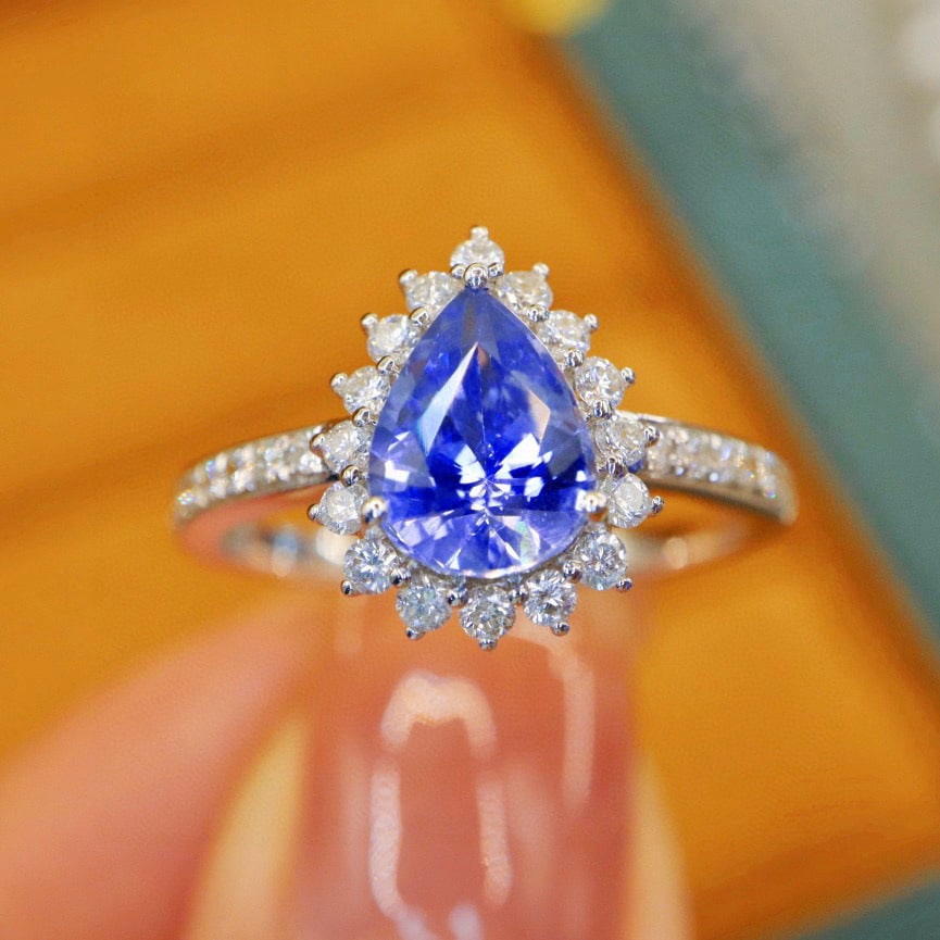 14k Gold 1.71 Ctw Natural Sapphire & Diamond Ring: Ref:230996402 // gold content:14k gold // ring size:7. 25us // // main gemstone:sapphire // shape:pear // carat weight:1. 36ct // color:cornflower blue // treatment:natural // // adjacent gemstone 2