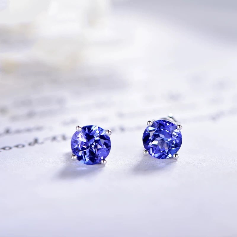 14k Gold 2.12 Ct Natural Tanzanite Earrings: Ref:230997011 // gold content:14k gold // main gemstone:tanzanite // shape:round // carat weight:2. 12ct // color:blue // treatment:natural // cut grade:g // Low Estimate: 3700 Condition: New High