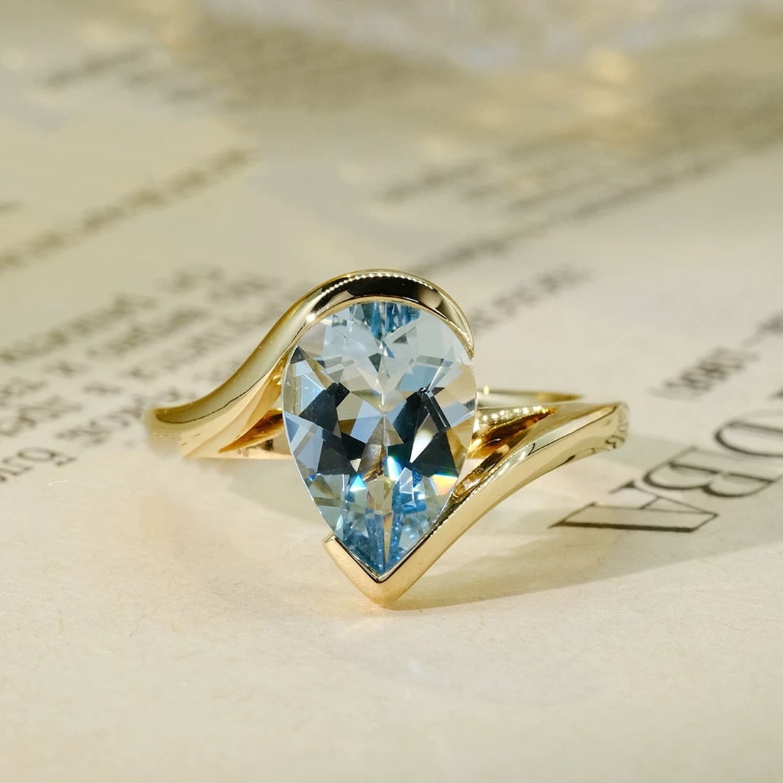 14k Gold 2.18 Ct Natural Aquamarine Ring: Ref:230997015 // gold content:14k gold // ring size:7. 25us // // main gemstone:aquamarine // shape:pear // carat weight:2. 18ct // color:blue // treatment:natural // Condition: New Low Estimate: