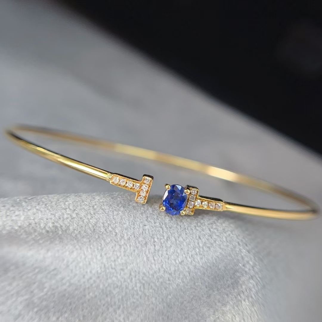 14k Gold 0.45 Ct Natural Sapphire & Diamond Bangle: Ref:230997029 // gold content:14k gold // main gemstone:sapphire // shape:oval // carat weight:0. 45ct // color:royal blue // treatment:natural // // adjacent gemstone 2 : diamond // number of