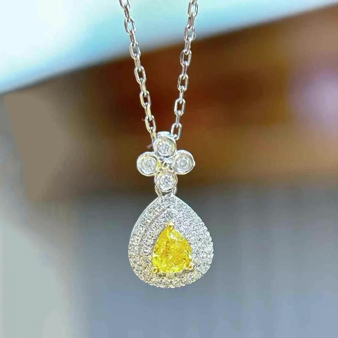 14k Gold 0.25 Ct Natural Yellow Diamond & Diamond Pendant( Without Chain ): Ref:230997106 // gold content:14k gold // main gemstone:yellow diamond // shape:pear // carat weight:0. 25ct // color:yellow // treatment:natural // // adjacent gemstone 2 : diamond // shape:round //