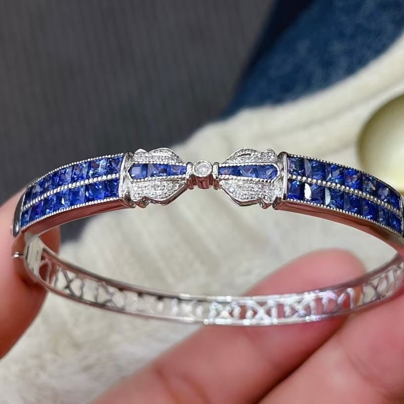 14k Gold 5.85 Ct Natural Sapphire & Diamond Bangle: Ref:230997132 // gold content:14k gold // main gemstone:sapphire // shape:princess // carat weight:5. 85ct // color:royal blue // treatment:natural // // adjacent gemstone 2 : diamond // number of