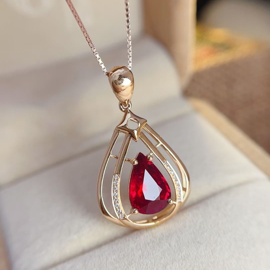 14k Gold 1.4 Ct Natural Tourmaline & Diamond Pendant( Without Chain ): Ref:230997153 // gold content:14k gold // main gemstone:tourmaline // shape:pear // carat weight:1. 4ct // color:red // treatment:natural // // adjacent gemstone 2 : diamond // number of stones:16 //
