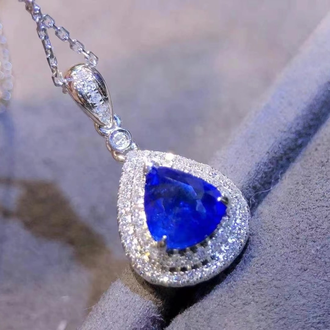 14k Gold 1.97 Ctw Natural Sapphire & Diamond Pendant( Without Chain ): Ref:230997192 // gold content:14k gold // main gemstone:sapphire // shape:pear // carat weight:1. 72ct // color:royal blue // treatment:natural // // adjacent gemstone 2 : diamond // shape:round //