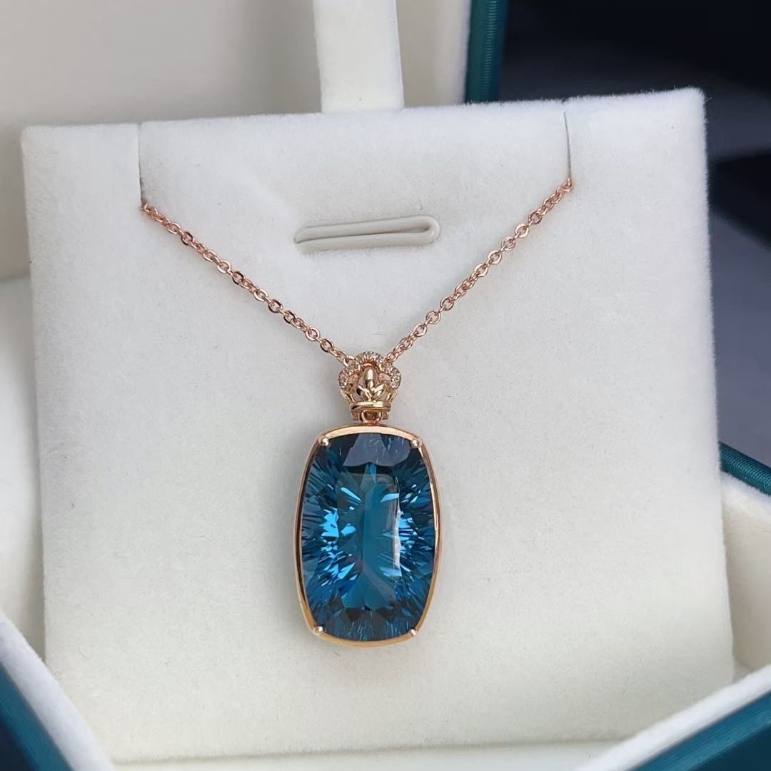 14k Gold 16.75 Ct Natural Topaz & Diamond Pendant( Without Chain ): Ref:230997205 // gold content:14k gold // main gemstone:topaz // shape:cushion // carat weight:16. 75ct // color:blue // treatment:natural // // adjacent gemstone 2 : diamond // number of stones:10