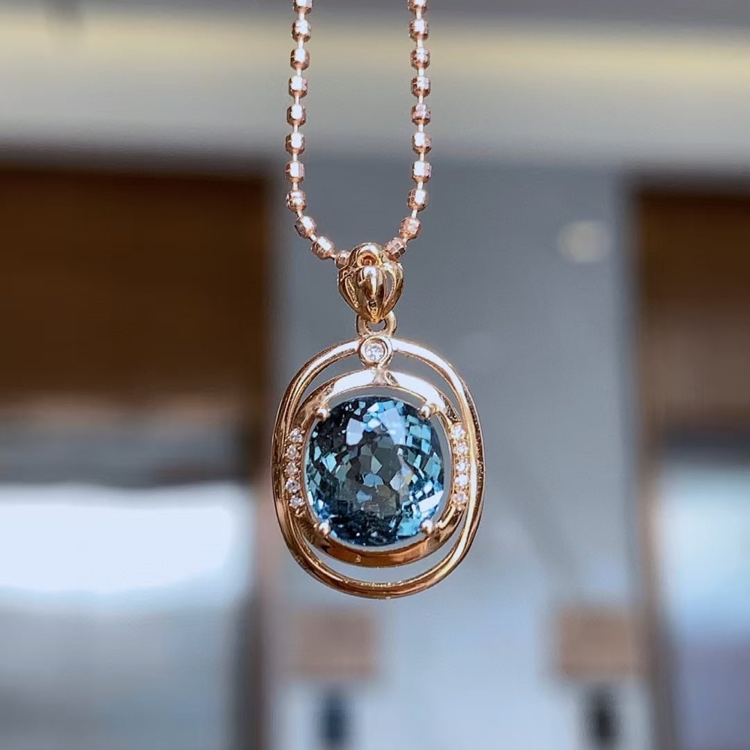 14k Gold 2.5 Ct Natural Tourmaline & Diamond Pendant( Without Chain ): Ref:230997214 // gold content:14k gold // main gemstone:tourmaline // shape:oval // carat weight:2. 5ct // color:blue // treatment:natural // // adjacent gemstone 2 : diamond // number of stones:11