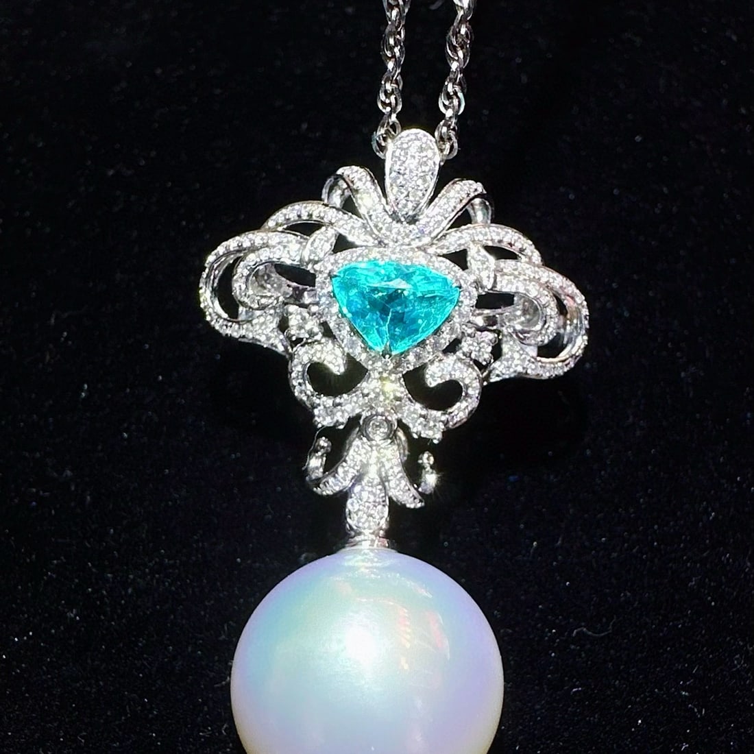 14k Gold 1.08 Ctw Natural Paraiba Tourmaline & Diamond Brooch/pendant( Without Chain ): Ref:230998016 // gold content:14k gold // main gemstone:paraiba tourmaline // shape:triangle // carat weight:0. 64ct // color:blue // treatment:natural // // adjacent gemstone 2 : diamond //