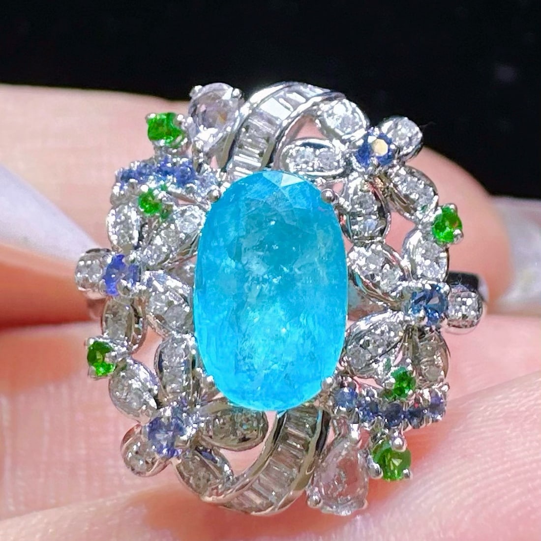 14k Gold 1.52 Ctw Natural Paraiba Tourmaline & Diamond Ring: Ref:230998018 // gold content:14k gold // ring size:7. 25us // // main gemstone:paraiba tourmaline // shape:oval // carat weight:1. 19ct // color:neon blue // treatment:natural // // adjacent