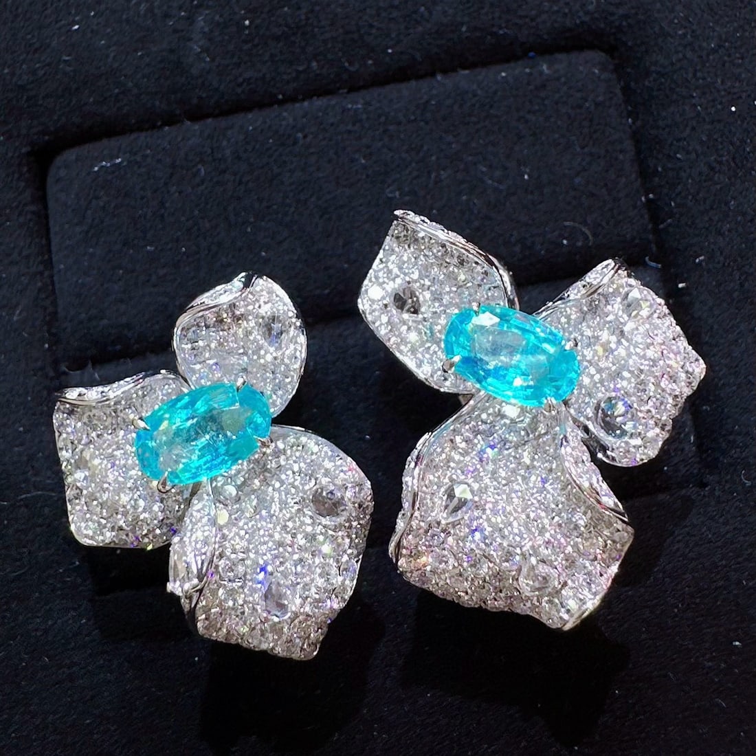 14k Gold 3.40 Ctw Natural Paraiba Tourmaline & Diamond Earrings: Ref:230998019 // gold content:14k gold // main gemstone:paraiba tourmaline // shape:oval // carat weight:1. 25ct // color:neon blue // treatment:natural // // adjacent gemstone 2 : diamond //