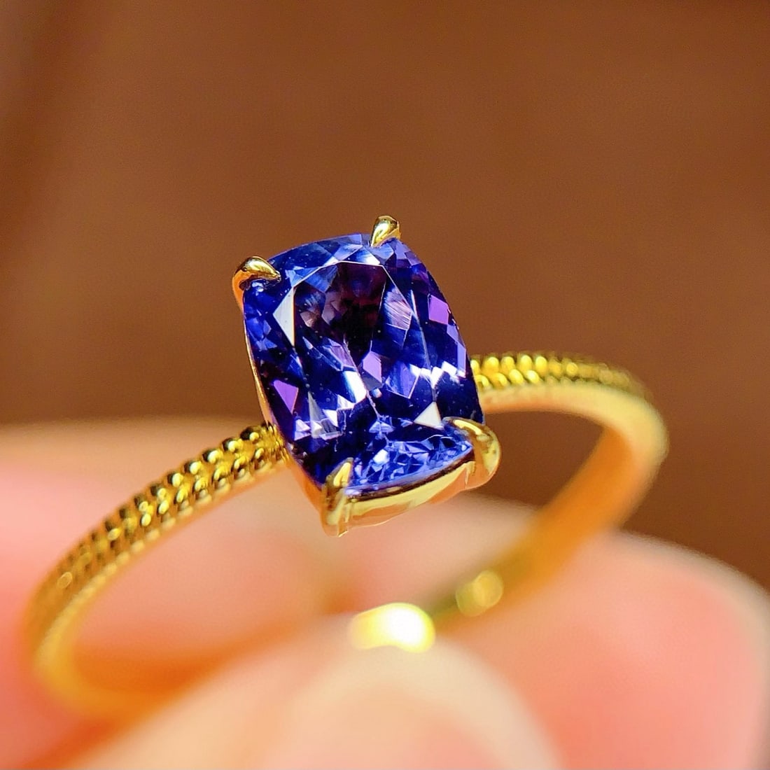 14k Gold 1.3 Ct Natural Tanzanite Ring: Ref:230998054 // gold content:14k gold // ring size:7. 25us // // main gemstone:tanzanite // shape:cushion // carat weight:1. 3ct // color:blue // treatment:natural // Low Estimate: 1300 High