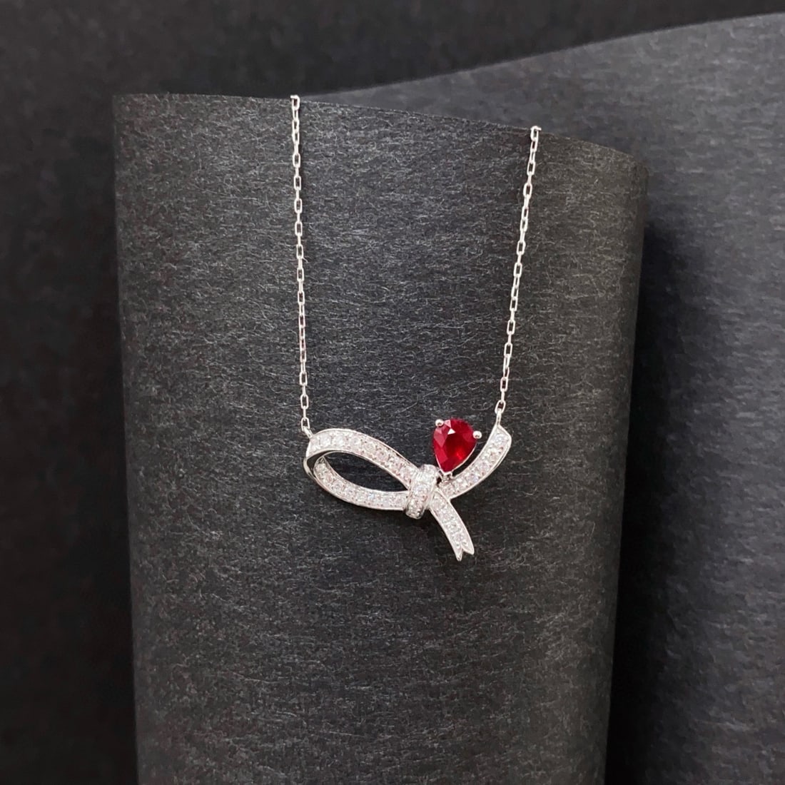 14k Gold 0.51 Ctw Vivid Red Natural Ruby & Diamond Necklace: Ref:230998100 // gold content:14k gold // main gemstone:ruby // shape:pear // carat weight:0. 33ct // color:vivid red // treatment:natural // // adjacent gemstone 2 : diamond // shape:round // carat w