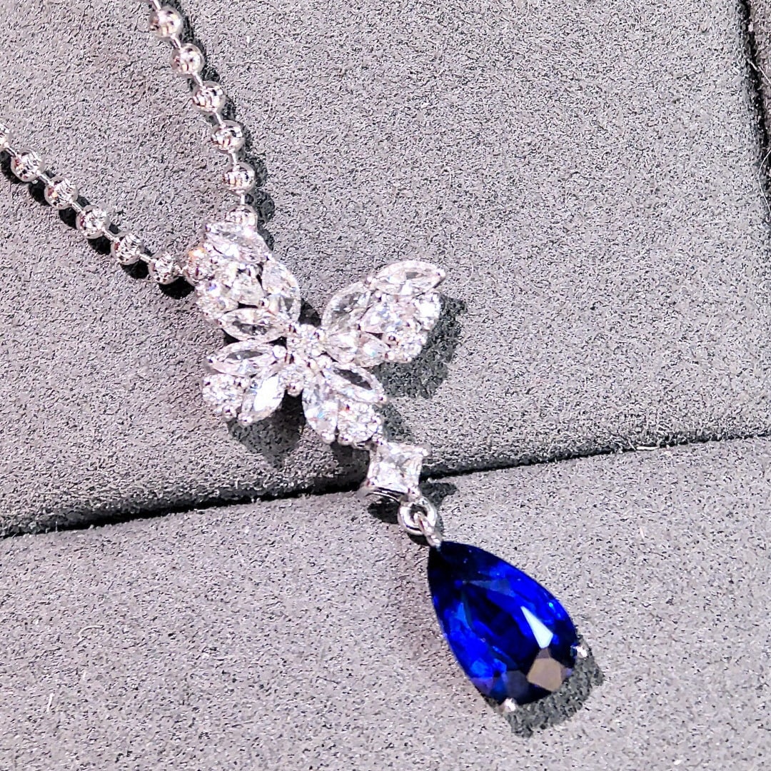 14k Gold 2.10 Ctw Natural Sapphire & Sapphire Pendant( Without Chain ): Ref:230998200 // gold content:14k gold // main gemstone:sapphire // shape:pear // carat weight:1. 39ct // color:royal blue // treatment:natural // // adjacent gemstone 2 : sapphire // shape:multiply