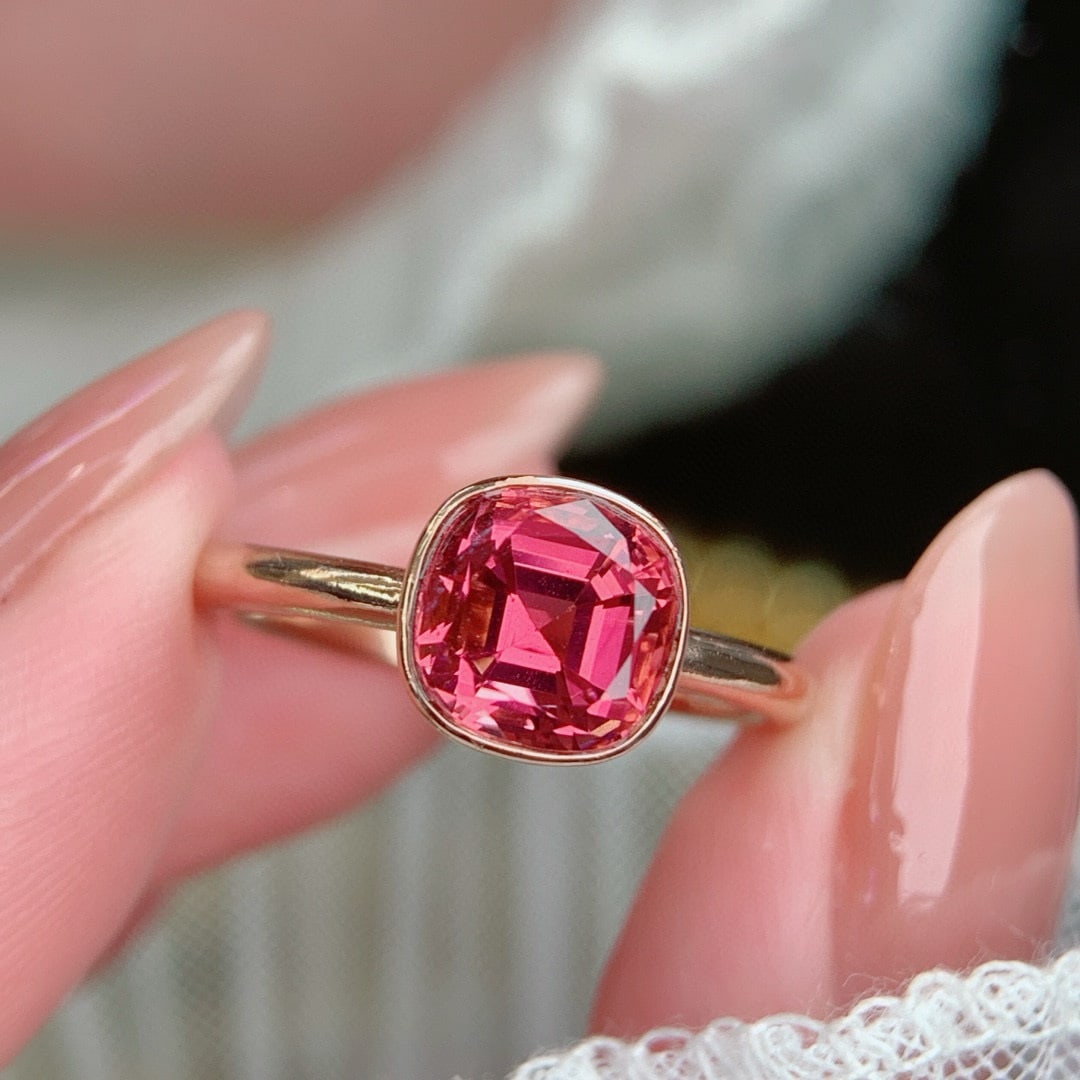14k Gold 1.95 Ct Natural Tourmaline Ring: Ref:230998211 // gold content:14k gold // ring size:7. 25us // // main gemstone:tourmaline // shape:cushion // carat weight:1. 95ct // color:pink // treatment:natural // Low Estimate: 2400 Condition: