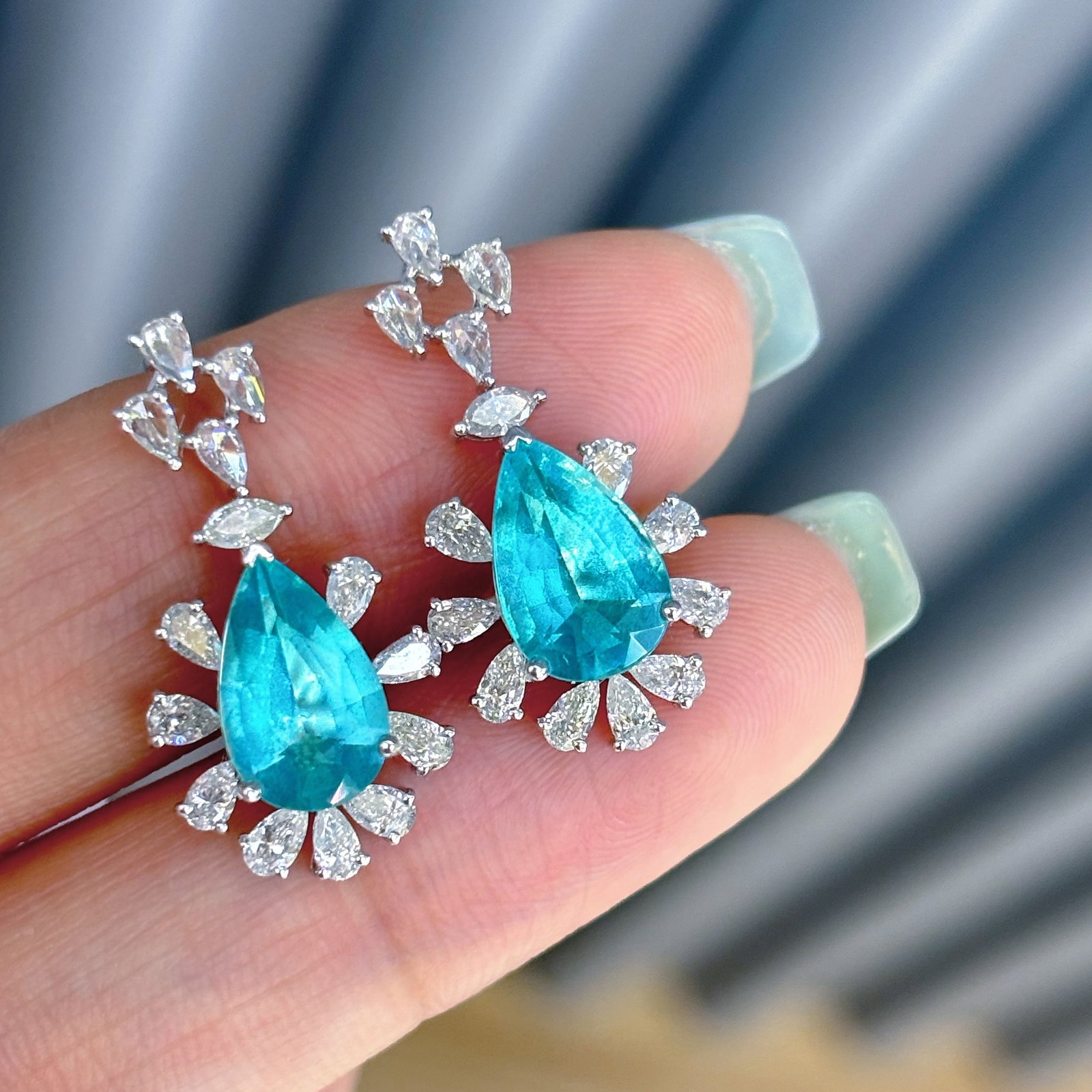 14k Gold 3.4 Ct Natural Paraiba Tourmaline & Diamond Earrings: Ref:230998213 // gold content:14k gold // main gemstone:paraiba tourmaline // shape:pear // carat weight:3. 4ct // color:blue // treatment:natural // // adjacent gemstone 2 : diamond //