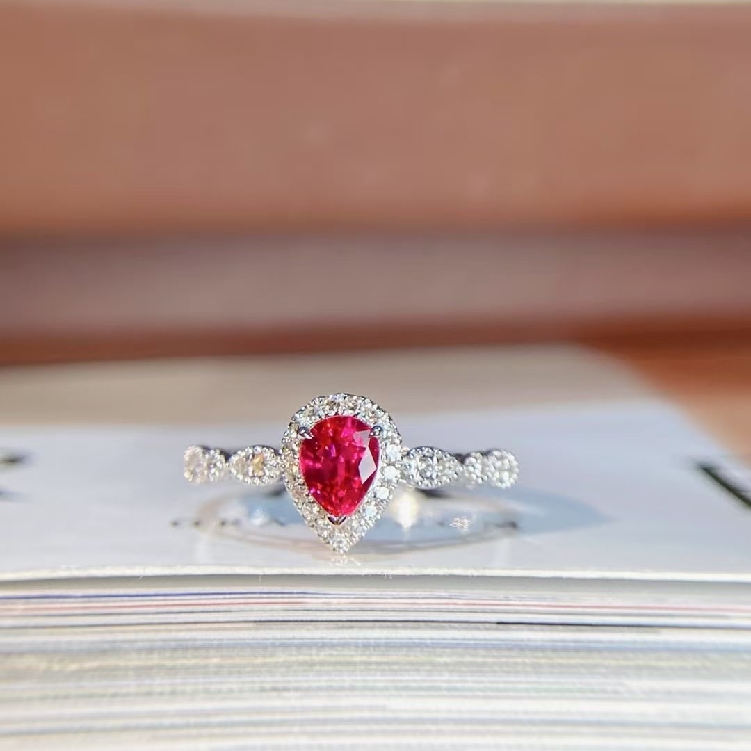 14k Gold 0.69 Ctw Natural Ruby & Diamond Ring: Ref:230998250 // gold content:14k gold // ring size:7. 25us // // main gemstone:ruby // shape:pear // carat weight:0. 56ct // color:red // treatment:natural // // adjacent gemstone 2 : diamond //