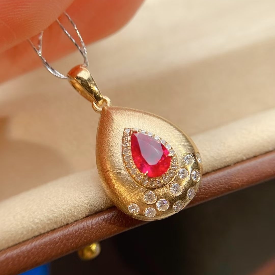 14k Gold 0.82 Ctw Natural Ruby & Diamond Pendant( Without Chain ): Ref:230998252 // gold content:14k gold // main gemstone:ruby // shape:pear // carat weight:0. 62ct // color:red // treatment:natural // // adjacent gemstone 2 : diamond // shape:round // carat