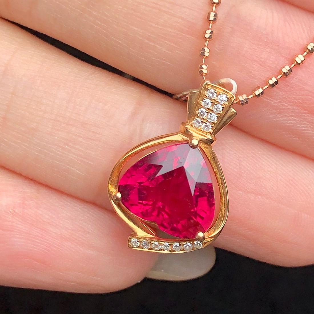 14k Gold 2.97 Ct Natural Tourmaline & Diamond Pendant( Without Chain ): Ref:230998313 // gold content:14k gold // main gemstone:tourmaline // shape:heart // carat weight:2. 97ct // color:red // treatment:natural // // adjacent gemstone 2 : diamond // number of stones:15 /