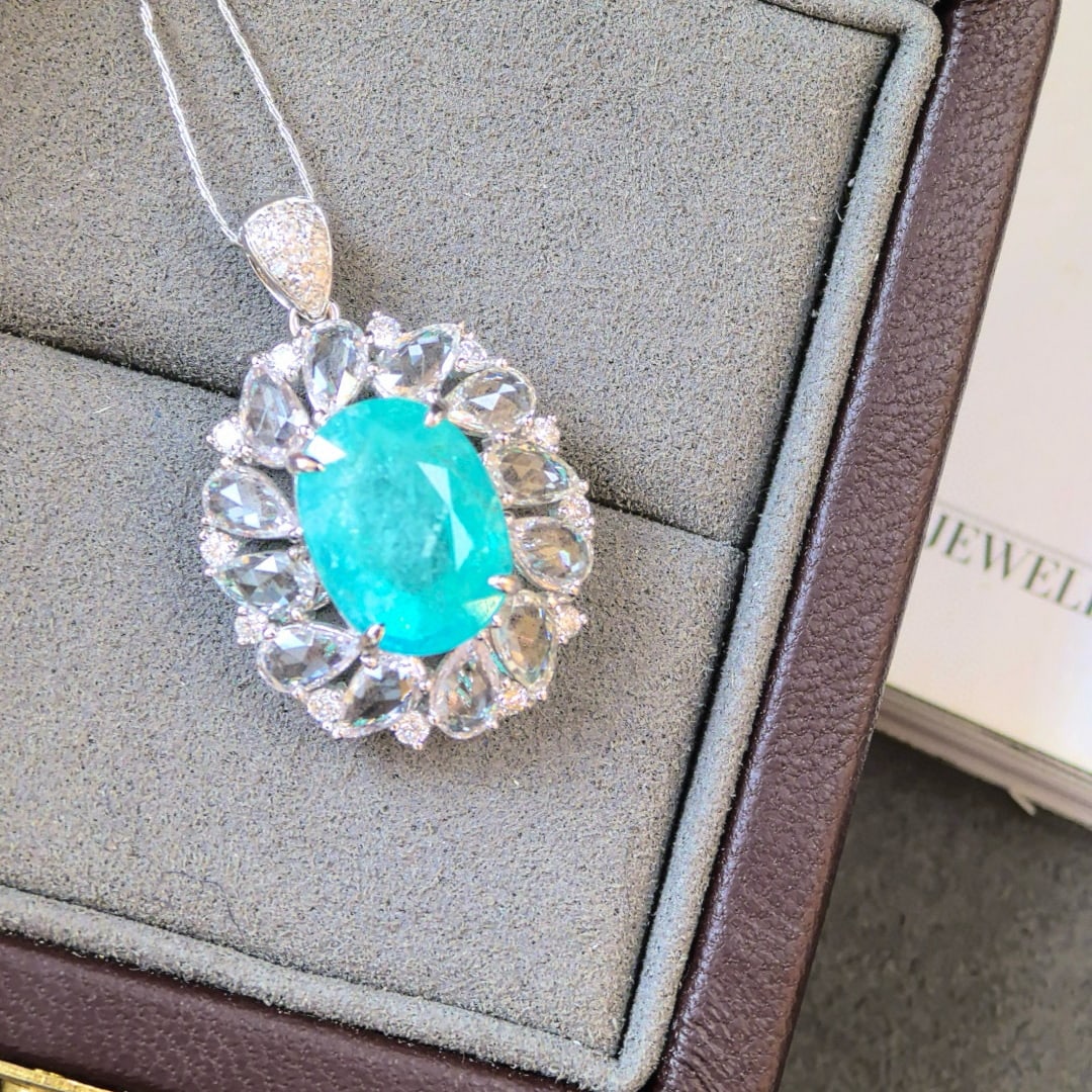 14k Gold 6.93 Ctw Natural Paraiba Tourmaline & Sapphire Pendant( Without Chain ): Ref:230998388 // gold content:14k gold // main gemstone:paraiba tourmaline // shape:oval // carat weight:4. 62ct // color:blue // treatment:natural // // adjacent gemstone 2 : sapphire // shape:pear