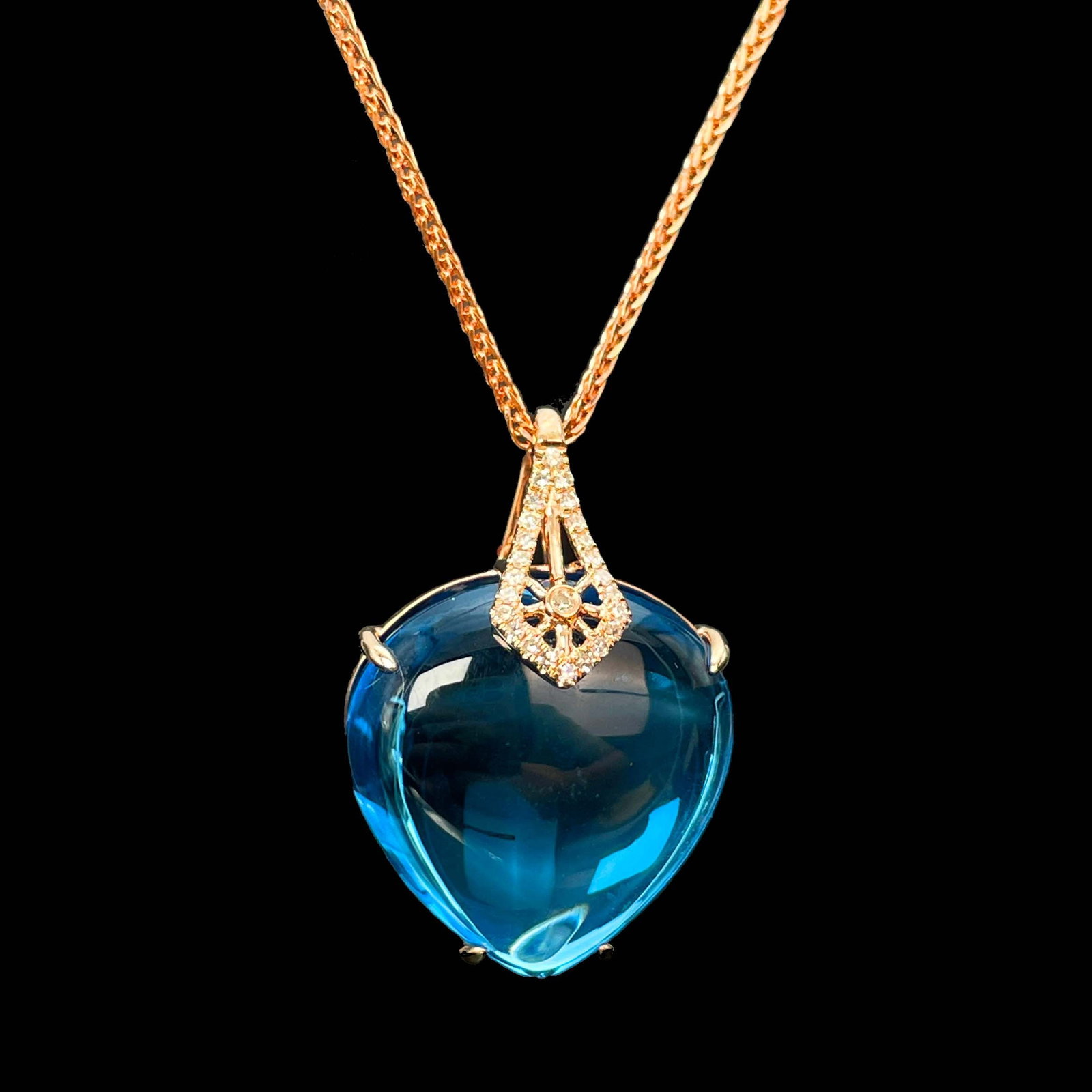 14k Gold 21.69 Ctw Natural Topaz & Diamond Pendant( Without Chain ): Ref:230999009 // gold content:14k gold // main gemstone:topaz // shape:pear // carat weight:21. 62ct // color:blue // treatment:natural // // adjacent gemstone 2 : diamond // number of stones:25 //