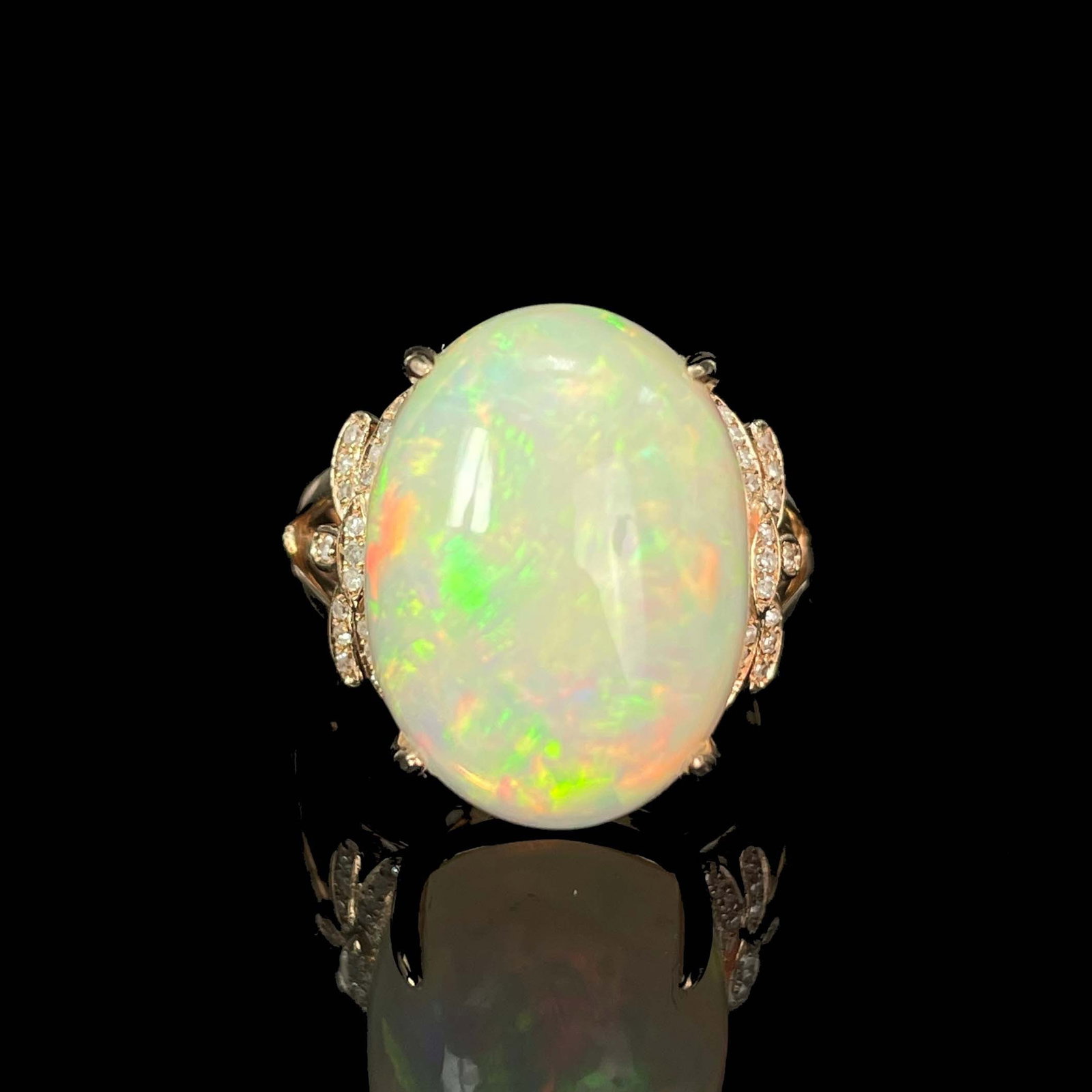 14k Gold 9.36 Ctw Natural Opal & Diamond Ring: Ref:230999030 // gold content:14k gold // ring size:7. 25us // // main gemstone:opal // shape:oval // carat weight:9. 25ct // color:color // treatment:natural // // adjacent gemstone 2 : diamond //