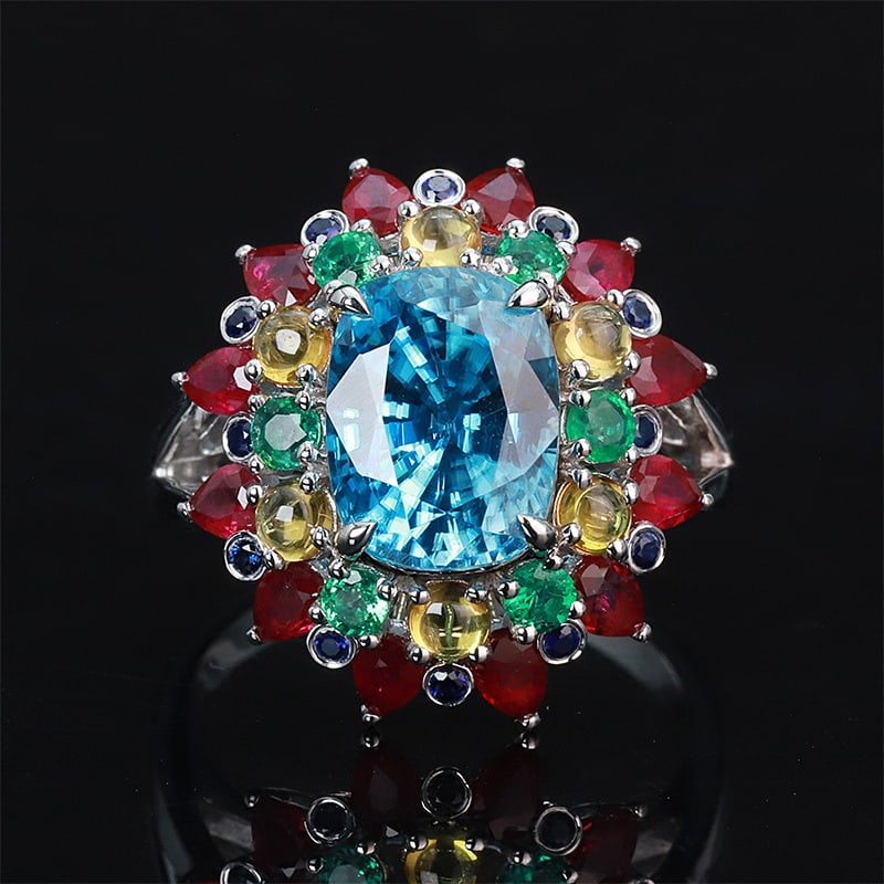 14k Gold 8.33 Ctw Natural Zircon & Ruby Ring: Ref:230999074 // gold content:14k gold // ring size:7. 25us // // main gemstone:zircon // shape:cushion // carat weight:6. 9ct // color:blue // treatment:natural // // adjacent gemstone 2 : ruby //