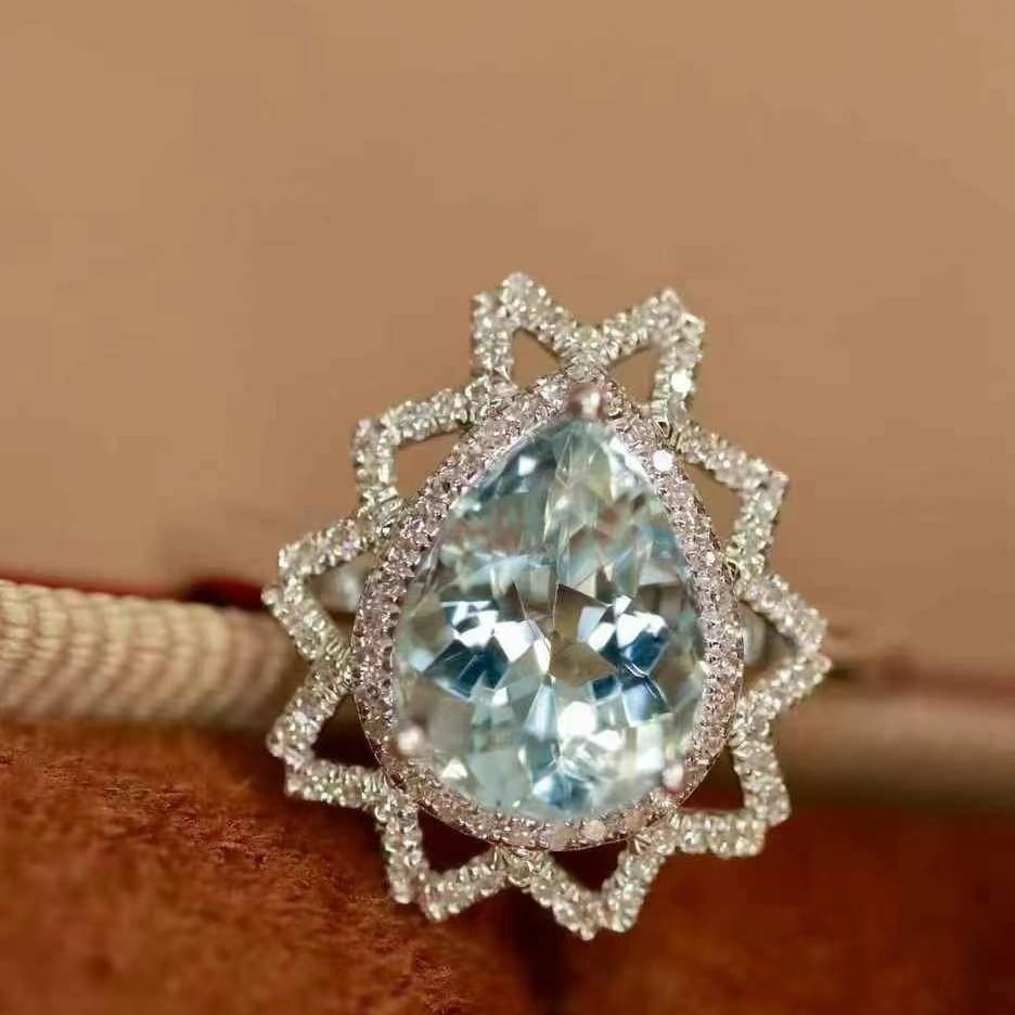 14k Gold 2.18 Ctw Natural Aquamarine & Diamond Ring: Ref:230999138 // gold content:14k gold // ring size:7. 25us // // main gemstone:aquamarine // shape:pear // carat weight:1. 93ct // color:blue // treatment:natural // // adjacent gemstone 2 : diamond