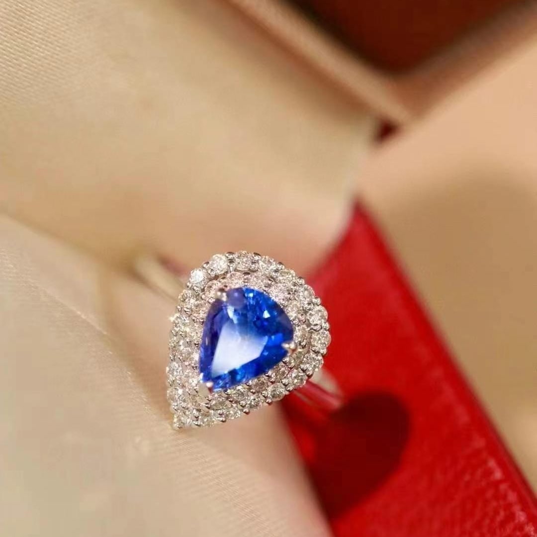 14k Gold 1.22 Ctw Natural Sapphire & Diamond Ring: Ref:230999220 // gold content:14k gold // ring size:7. 25us // // main gemstone:sapphire // shape:pear // carat weight:0. 95ct // color:cornflower blue // treatment:natural // // adjacent gemstone 2