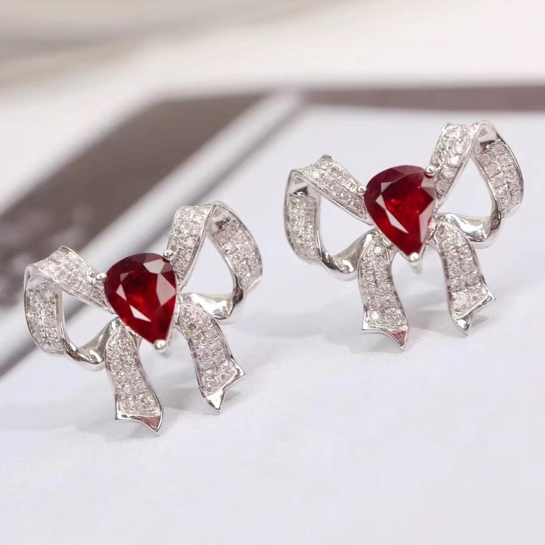 14k Gold 1.91 Ctw Natural Ruby & Diamond Earrings: Ref:231000024 // gold content:14k gold // main gemstone:ruby // shape:pear // carat weight:1. 5ct // color:pigeonblood red // treatment:natural // // adjacent gemstone 2 : diamond // shape:round //