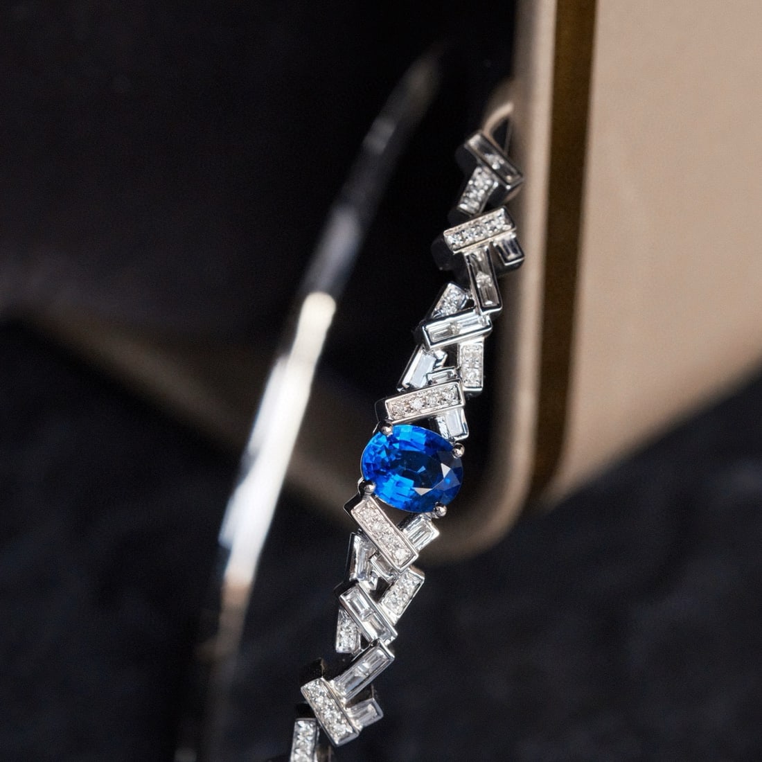 14k Gold 1.00 Ctw Natural Sapphire & Diamond Bangle: Ref:231000050 // gold content:14k gold // main gemstone:sapphire // shape:oval // carat weight:0. 70ct // color:blue // treatment:natural // cut grade:g // // adjacent gemstone 2 : diamond //