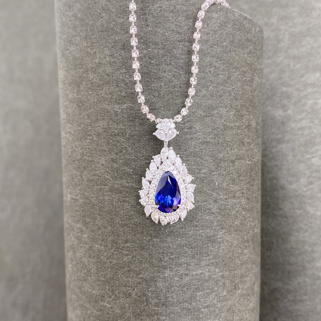 14k Gold 2.21 Ctw Natural Sapphire & Diamond Pendant( Without Chain ): Ref:231000110 // gold content:14k gold // main gemstone:sapphire // shape:pear // carat weight:1. 56ct // color:royal blue // treatment:natural // // adjacent gemstone 2 : diamond // shape:multiply