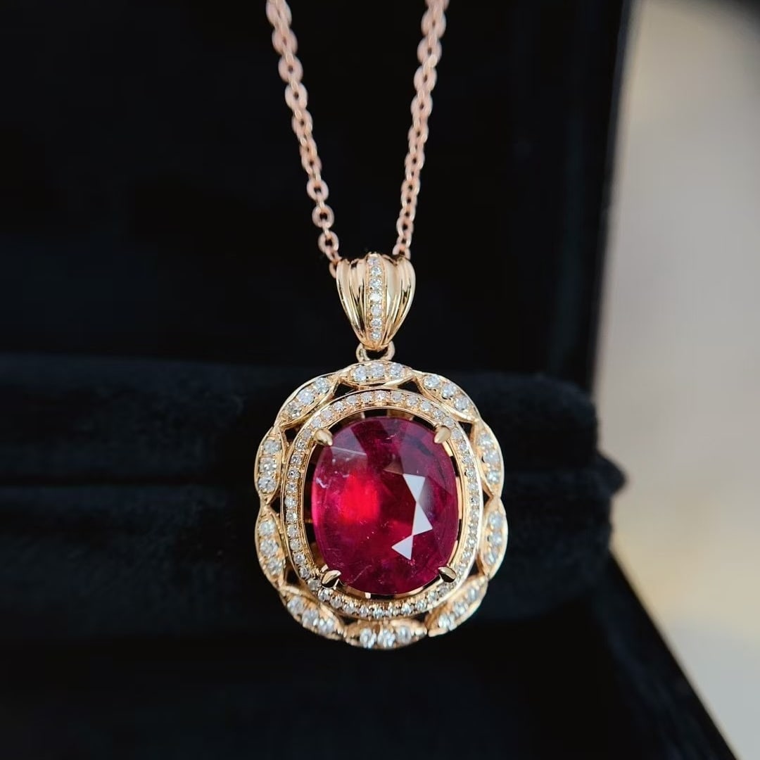 14k Gold 3.55 Ct Natural Tourmaline & Diamond Pendant( Without Chain ): Ref:231000114 // gold content:14k gold // main gemstone:tourmaline // shape:oval // carat weight:3. 55ct // color:red // treatment:natural // // adjacent gemstone 2 : diamond // number of stones:82 //