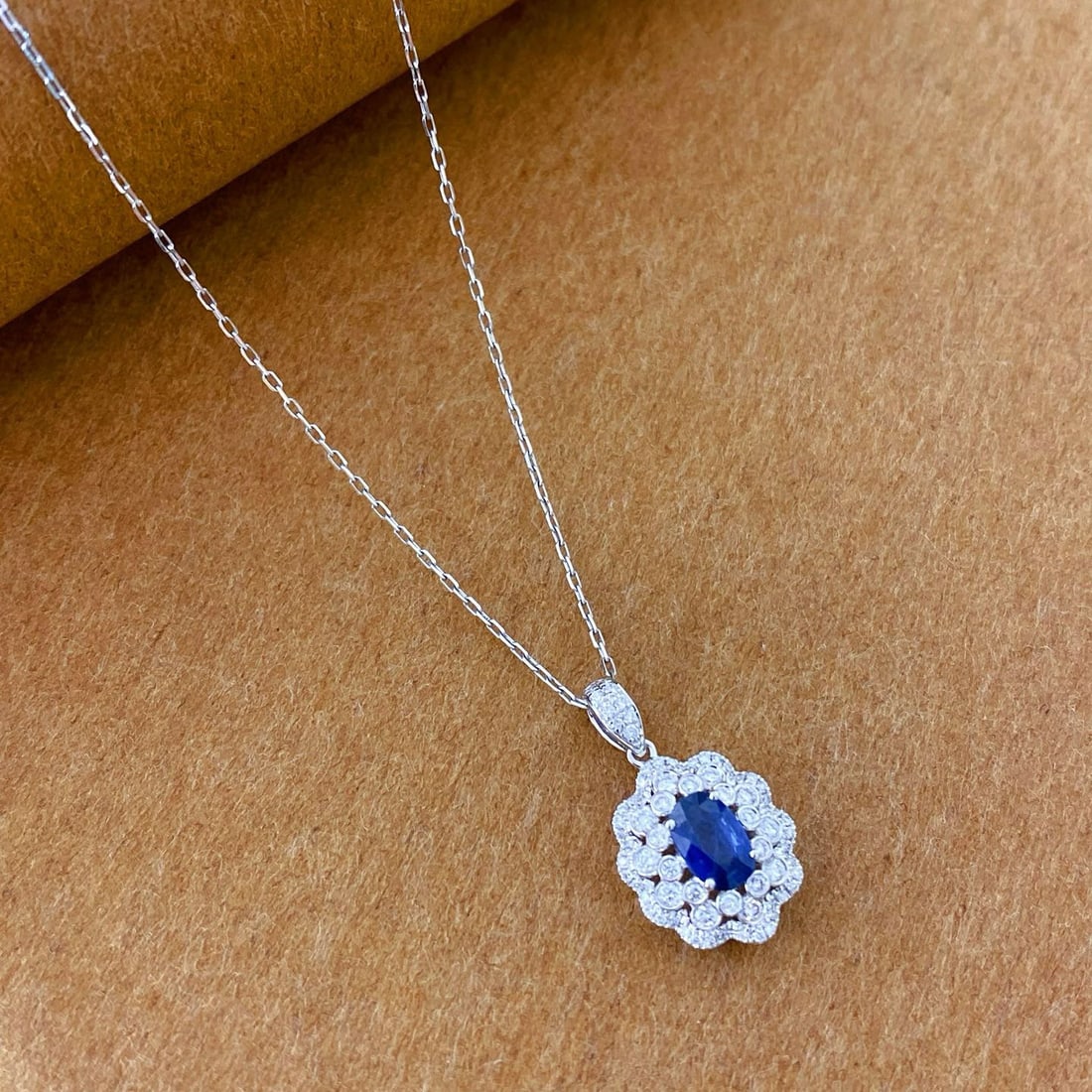 14k Gold 0.88 Ctw Natural Sapphire & Diamond Pendant( Without Chain ): Ref:231000124 // gold content:14k gold // main gemstone:sapphire // shape:oval // carat weight:0. 6ct // color:royal blue // treatment:natural // // adjacent gemstone 2 : diamond // shape:round //