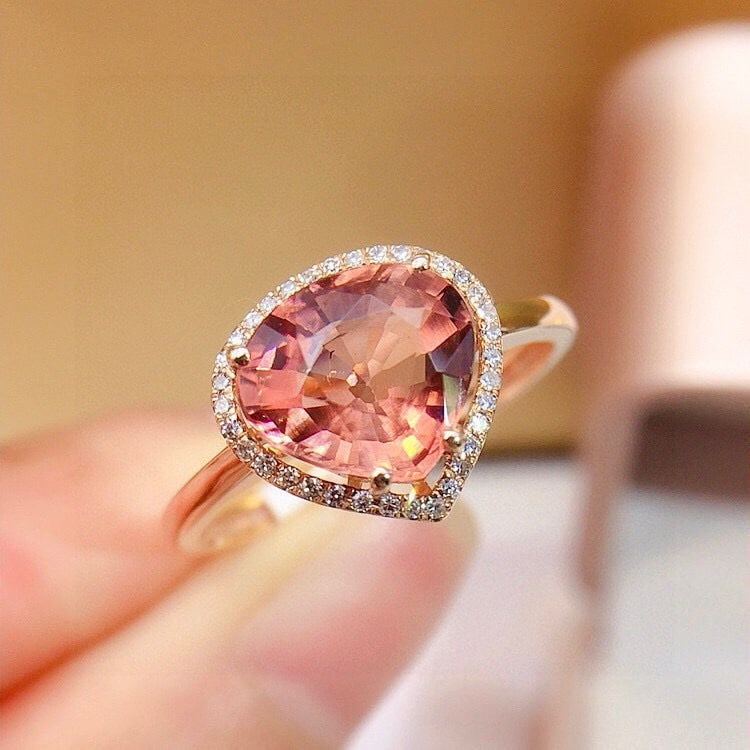 14k Gold 2.7 Ct Natural Tourmaline & Diamond Ring: Ref:231000141 // gold content:14k gold // ring size:7. 25us // // main gemstone:tourmaline // shape:pear // carat weight:2. 7ct // color:orange // treatment:natural // // adjacent gemstone 2 :