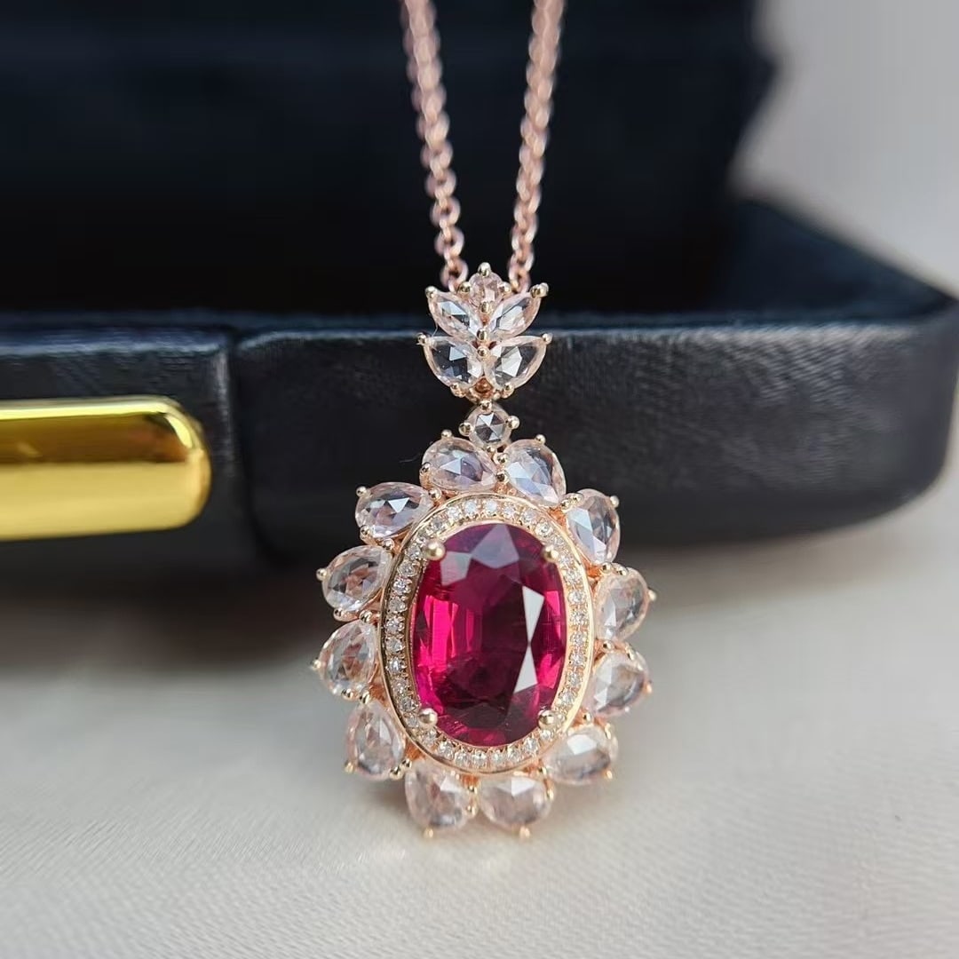 14k Gold 1.40 Ct Natural Tourmaline & Sapphire Pendant( Without Chain ): Ref:231000148 // gold content:14k gold // main gemstone:tourmaline // shape:oval // carat weight:1. 40ct // color:red // treatment:natural // // adjacent gemstone 2 : sapphire // shape:multiply //