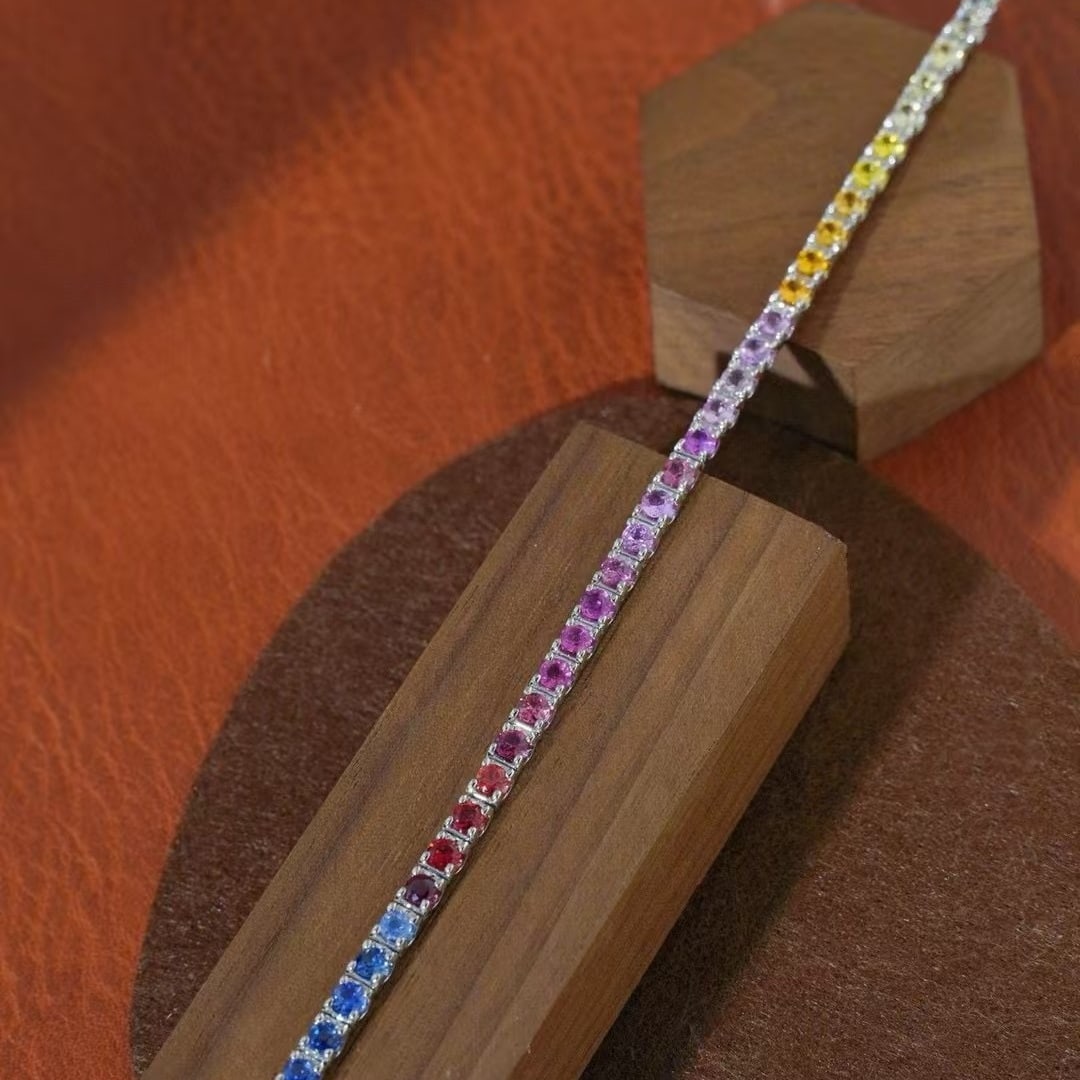 14k Gold 6 Ct Natural Sapphire Bracelet: Ref:231000155 // gold content:14k gold // main gemstone:sapphire // shape:round // carat weight:6ct // color:color // treatment:natural // cut grade:g // Condition: New Low Estimate: 7500.00 High