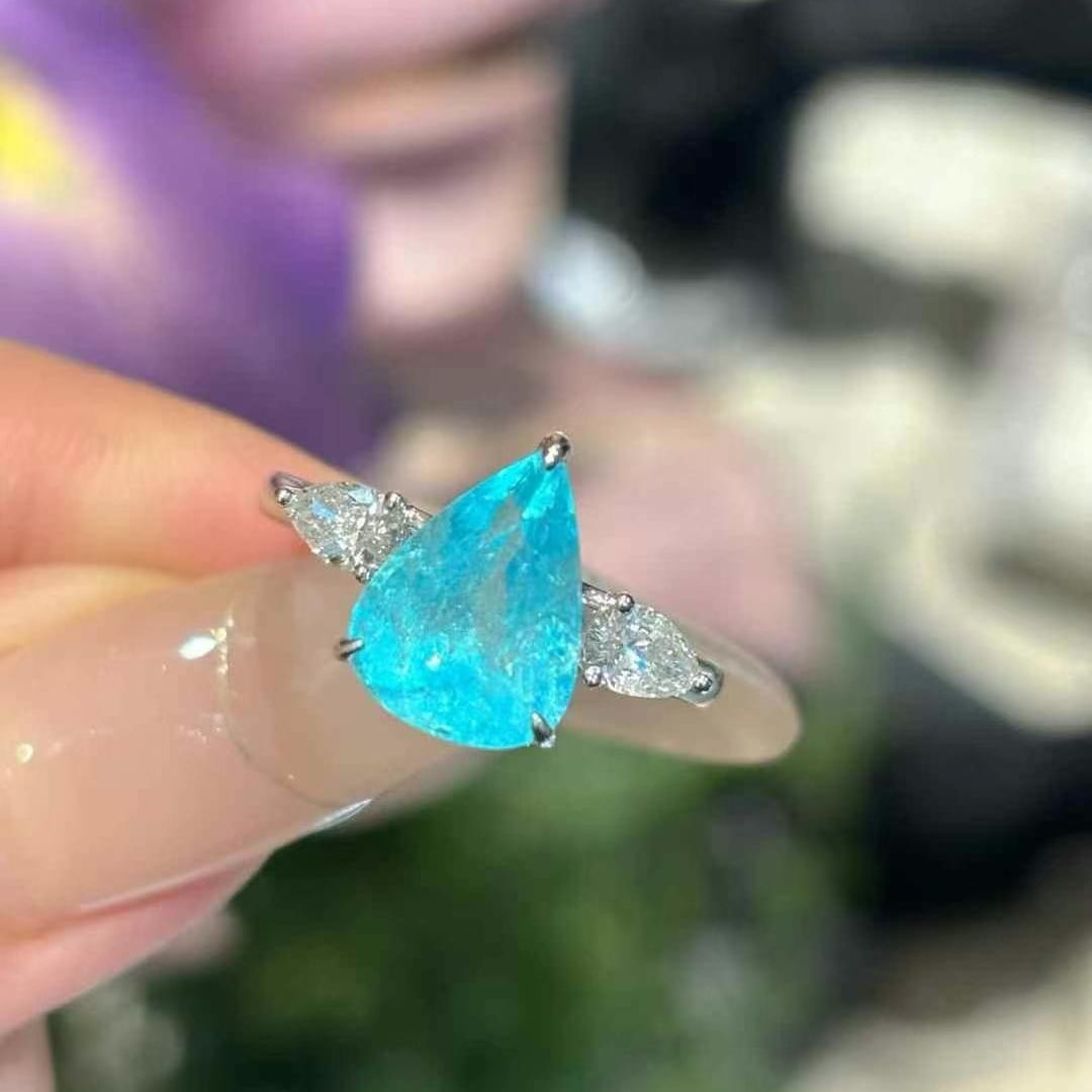 14k Gold 3 Ct Natural Paraiba Tourmaline & Diamond Ring: Ref:231000164 // gold content:14k gold // ring size:7. 25us // // main gemstone:paraiba tourmaline // shape:pear // carat weight:3ct // color:blue // treatment:natural // // adjacent gemstone 2 :