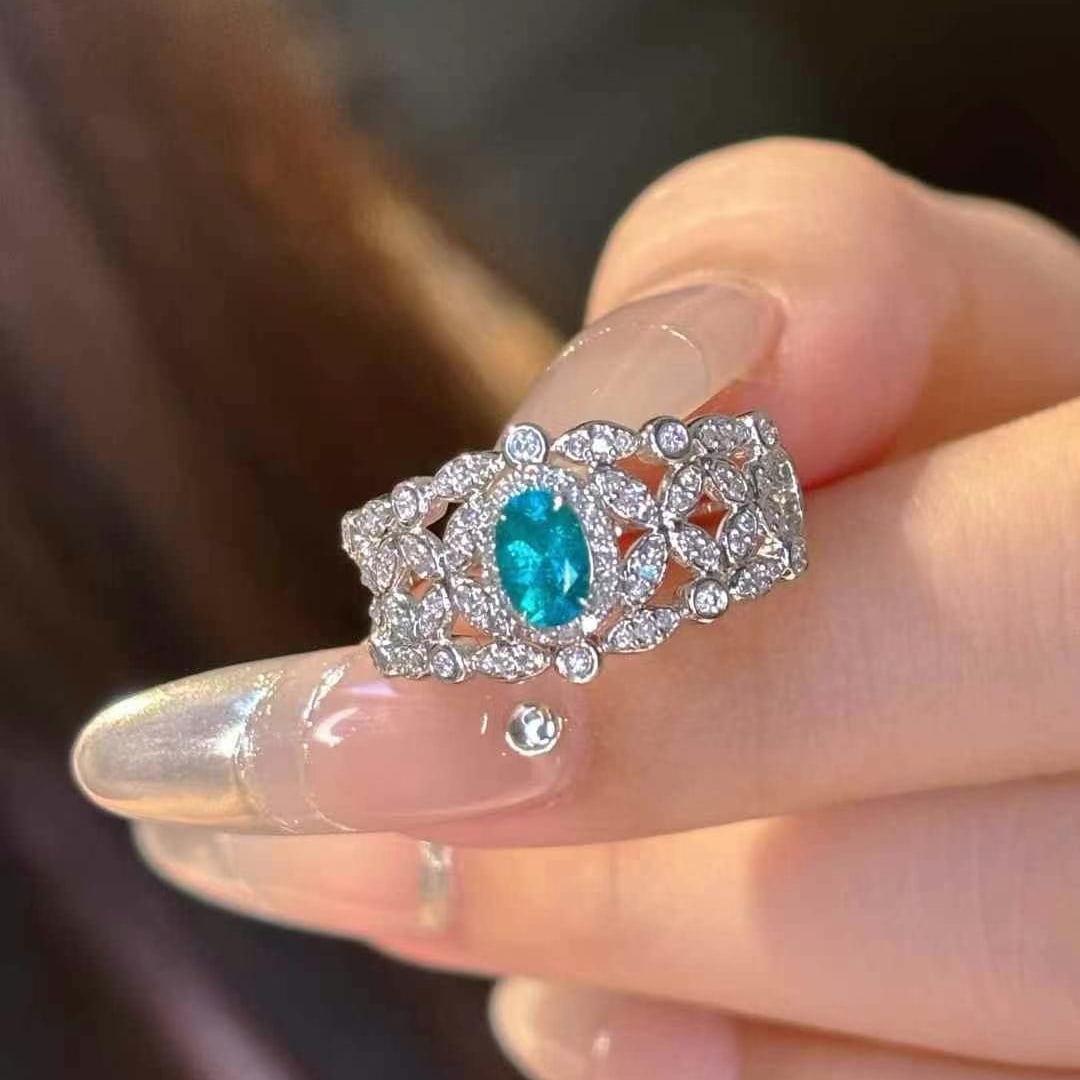14k Gold 0.4 Ct Natural Paraiba Tourmaline & Diamond Ring: Ref:231000166 // gold content:14k gold // ring size:7. 25us // // main gemstone:paraiba tourmaline // shape:oval // carat weight:0. 4ct // color:blue // treatment:natural // // adjacent gemstone 2 :