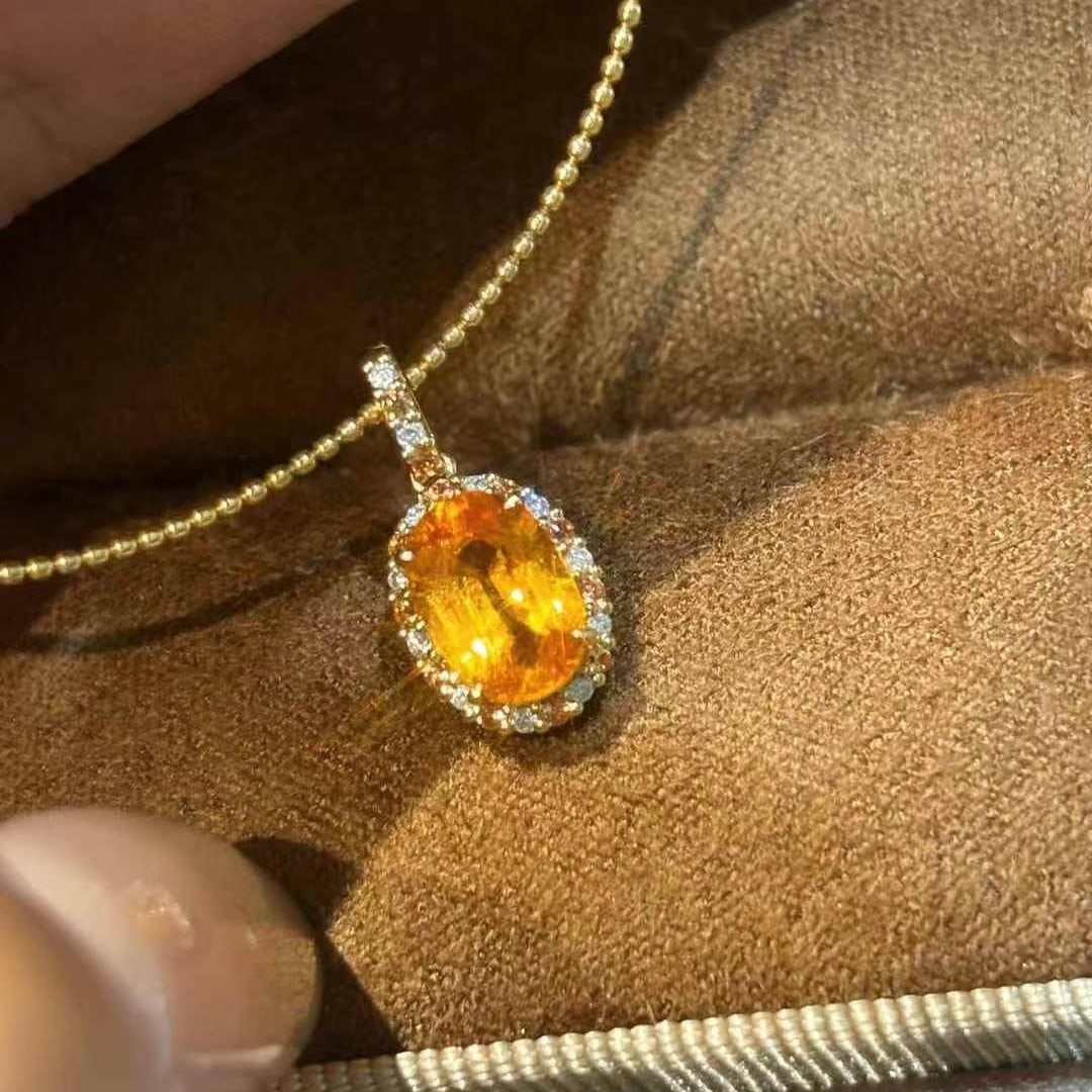 14k Gold 1.2 Ct Natural Spessartine & Diamond Pendant( Without Chain ): Ref:231000180 // gold content:14k gold // main gemstone:spessartine // shape:oval // carat weight:1. 2ct // color:orange // treatment:natural // // adjacent gemstone 2 : diamond // shape:round // clar