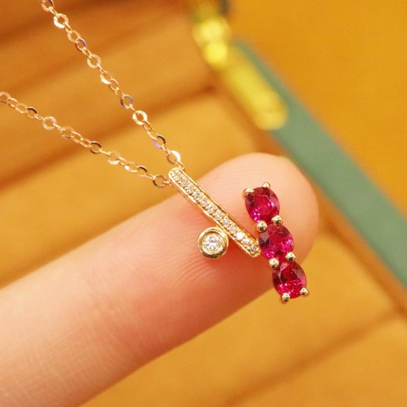 14k Gold 0.83 Ctw Natural Ruby & Diamond Pendant( Without Chain ): Ref:231000218 // gold content:14k gold // main gemstone:ruby // shape:oval // carat weight:0. 78ct // color:red // treatment:natural // // adjacent gemstone 2 : diamond // number of stones:13 //