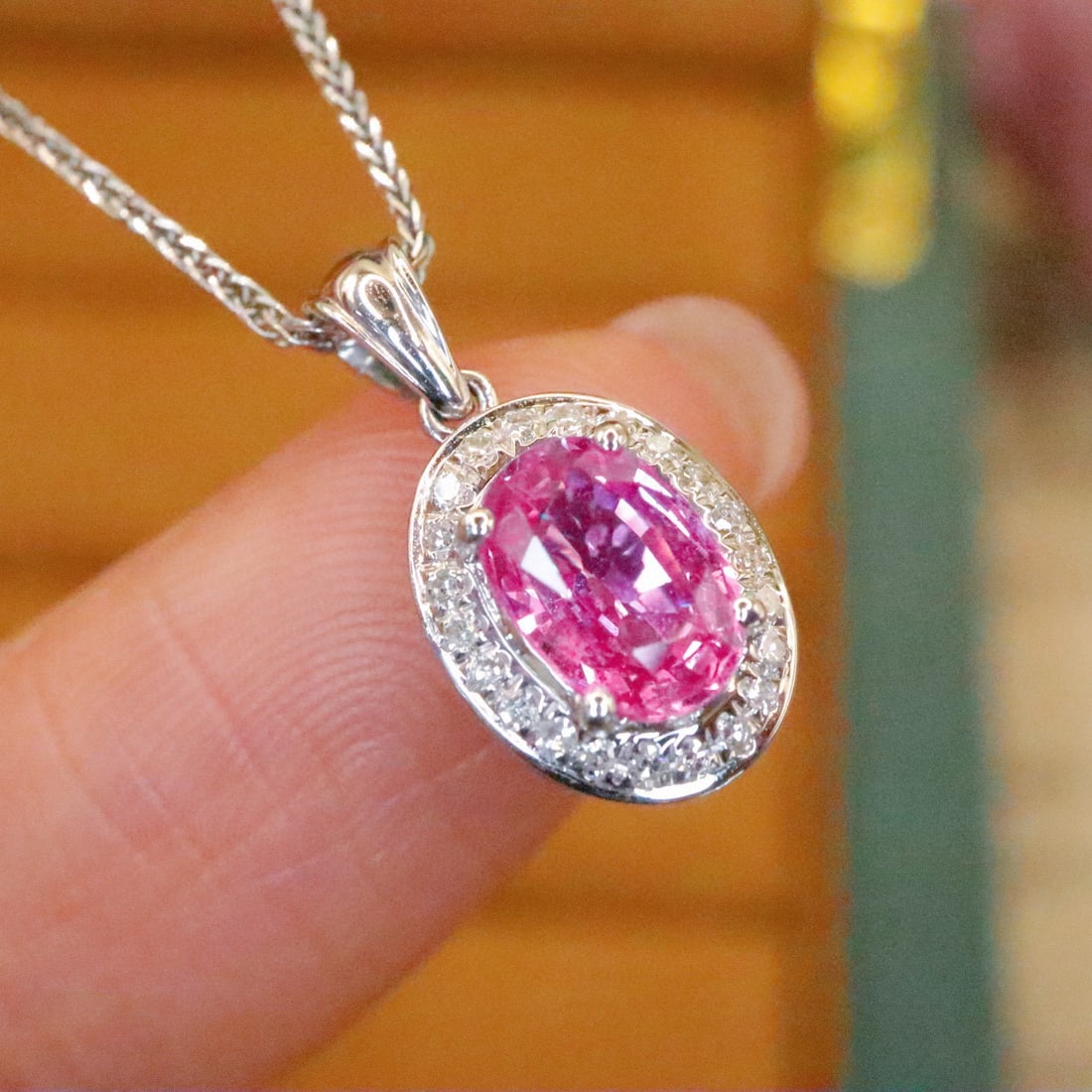 14k Gold 0.99 Ctw Natural Padparadscha Sapphire & Diamond Pendant( Without Chain ): Ref:231000227 // gold content:14k gold // main gemstone:padparadscha sapphire // shape:oval // carat weight:0. 88ct // color:orangish pink // treatment:natural // // adjacent gemstone 2 : diamond //