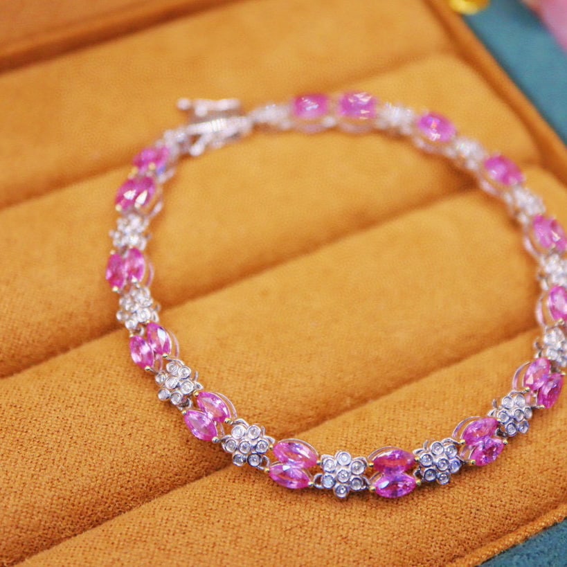 14k Gold 6.00 Ctw Natural Padparadscha Sapphire & Diamond Bracelet: Ref:231000228 // gold content:14k gold // main gemstone:padparadscha sapphire // shape:marquise // carat weight:5. 51ct // color:orangish pink // treatment:natural // // adjacent gemstone 2 : diamond