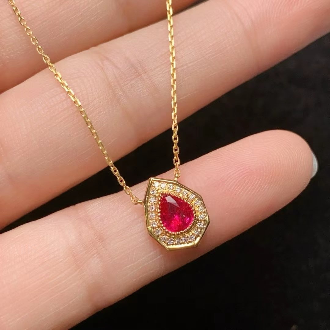 14k Gold 0.9 Ct Natural Ruby & Diamond Necklace: Ref:231000235 // gold content:14k gold // main gemstone:ruby // shape:pear // carat weight:0. 9ct // color:red // treatment:natural // // adjacent gemstone 2 : diamond // number of stones:22 // shape: