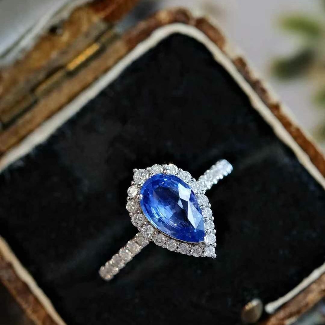 14k Gold 1.92 Ctw Natural Sapphire & Diamond Ring: Ref:231000267 // gold content:14k gold // ring size:7. 25us // // main gemstone:sapphire // shape:pear // carat weight:1. 53ct // color:cornflower blue // treatment:natural // // adjacent gemstone 2