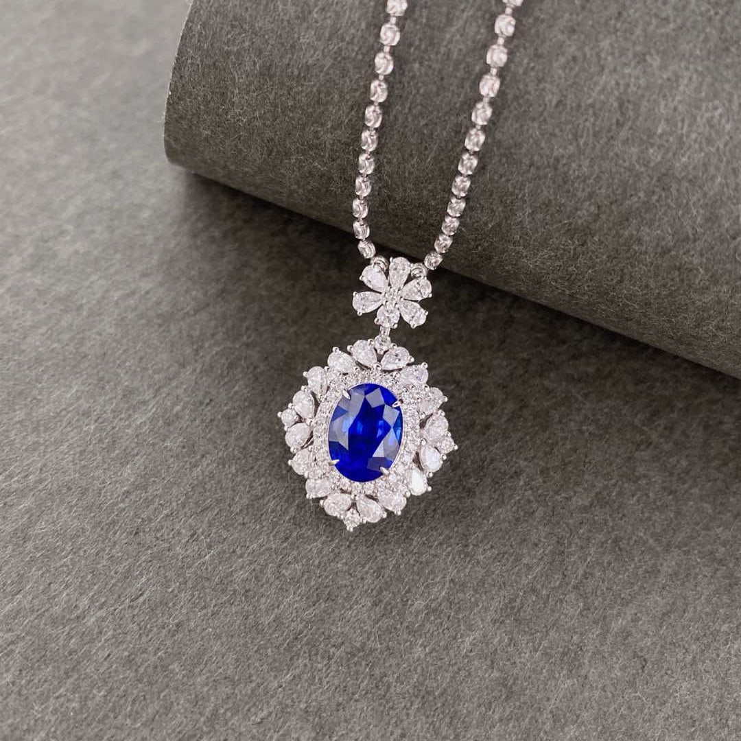 14k Gold 3.49 Ctw Natural Sapphire & Diamond Pendant( Without Chain ): Ref:231000338 // gold content:14k gold // main gemstone:sapphire // shape:oval // carat weight:2. 32ct // color:royal blue // treatment:natural // // adjacent gemstone 2 : diamond // shape:multiply //