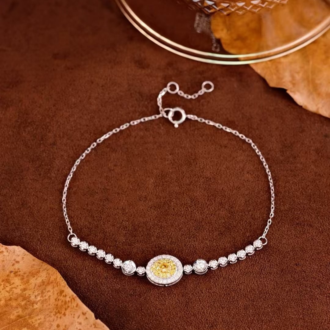14k Gold 0.60 Ctw Natural Yellow Diamond & Diamond Bracelet: Ref:231000408 // gold content:14k gold // main gemstone:yellow diamond // shape:oval // carat weight:0. 18ct // color:yellow // treatment:natural // // adjacent gemstone 2 : diamond // shape:round //