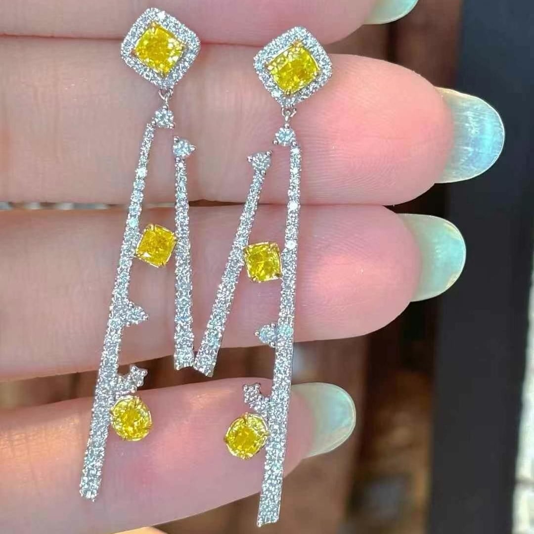 14k Gold 2.5 Ct Natural Color Diamond Earrings: Ref:231000409 // gold content:14k gold // main gemstone:diamond // shape:multiply // carat weight:2. 5ct // clarity grade:vs-si // color:color // treatment:natural // Condition: New Low Estimate: